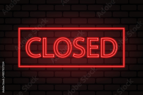 Red neon ''closed'' sign on brick wall background.