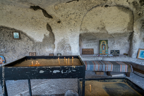 Orthodox Cave Chapel with Icon Altar and Candles