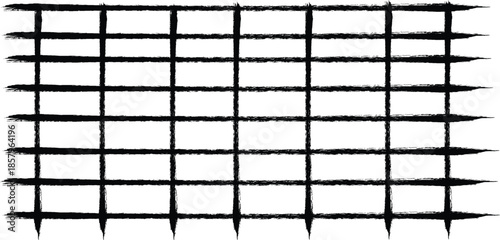 Silhouette of a metal grid fence with sharp barbed wire silhouette