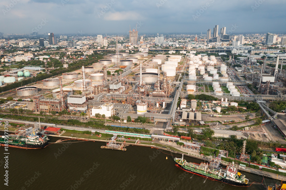 Fototapeta premium Bang Chak Oil Refinery is located along Chaopraya rivier in Bangkok Thailand. Aerial view from a drone.