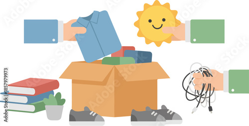 Charity donation concept with hands putting items into a cardboard box.