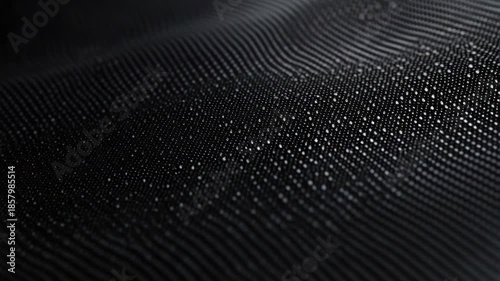 This captures the intricate details of water droplets glistening on a textured surface. The high resolution and shallow depth of field create an abstract visual effect.