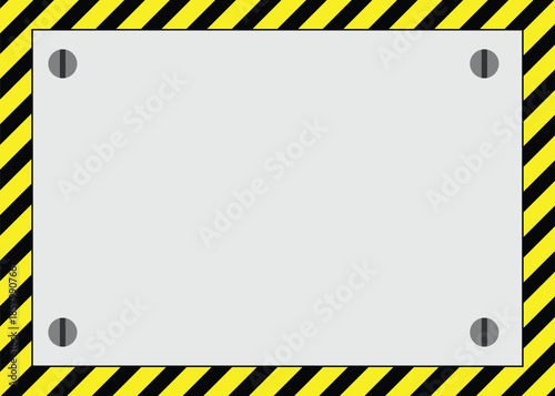 Blank metal plate sign on a yellow and black striped warning hazard background