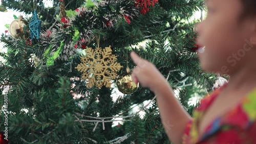 Children decorating christmas tree