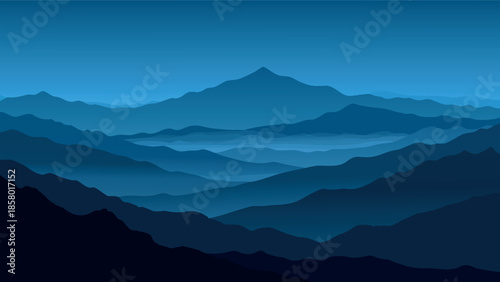 Layered mountain ranges in shades of deep blue create a serene landscape