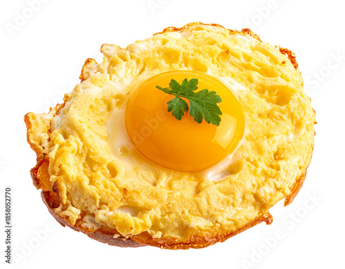 A perfectly fried egg with a bright yellow yolk and a sprig of parsley on top isolated on a white background.