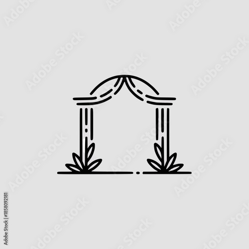 Elegant wedding archway with floral decorations and draping