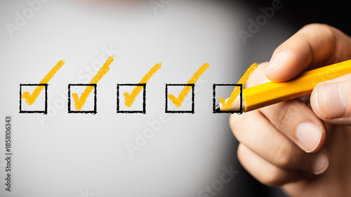 A hand marking multiple checkboxes to represent task verification, progress tracking and organized workflow management.
