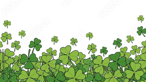 A vibrant illustration of lush green shamrocks filling the bottom of the frame against a clean white background.