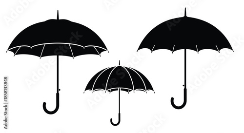 Three different black umbrella silhouettes shown in varying sizes and orientations against a plain white background for rain themes.