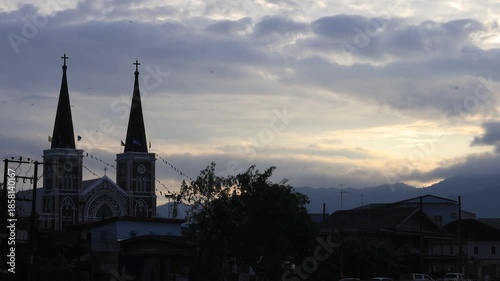 This waterfront video view in a riverside community in Chanthaburi shows the lights and houses along the water, as well as a Christian church – a beautiful tourist attraction in Thailand.