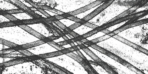 Intersecting tire tracks on light dirty ground texture pattern isolated on white background