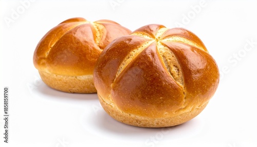 Two round bread rolls with glossy golden-brown crust, patterned with five curved slits radiating like a flower.