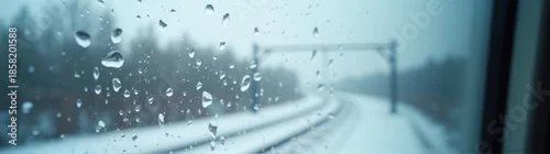 Obraz View of a train track through a window with raindrops