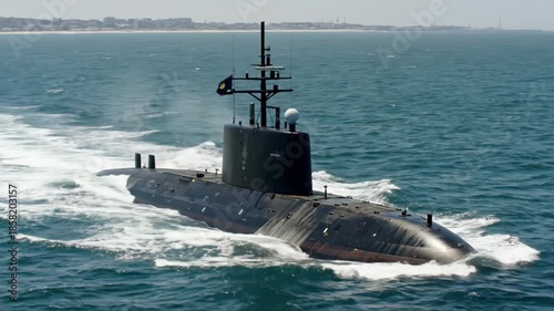 A large black submarine is traveling through the ocean with waves crashing against it