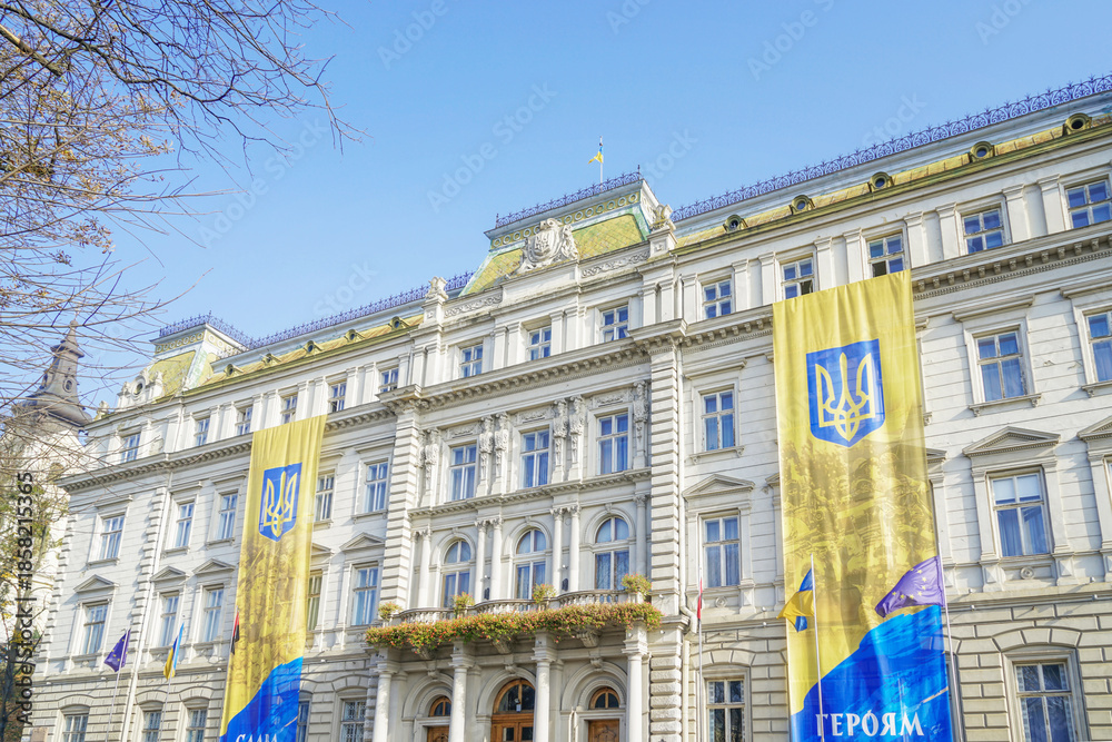 Fototapeta premium Lviv Classical Architecture with Ukrainian Flags, Ukraine