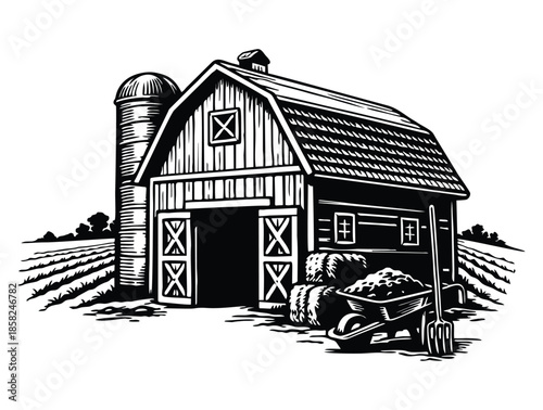 Classic rural farm barn with a silo and hay bales.
