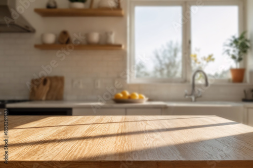 Wooden tabletop with blurred warm kitchen background and sunlight.	