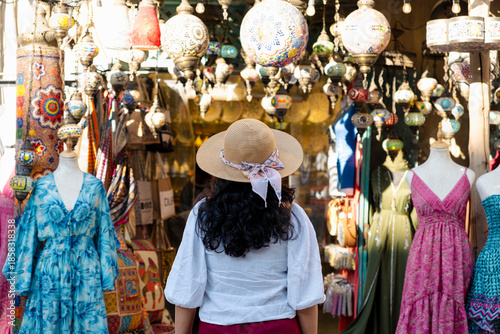 stock photo of a tourist woman exploring local ceramic market in Turkey, Istanbul, a girl exploring local markets on her solo trip to Turkey, face not showing
