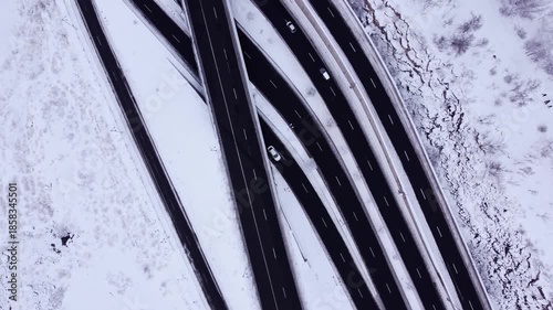 Top down aerial view of a busy highway on a snowy day