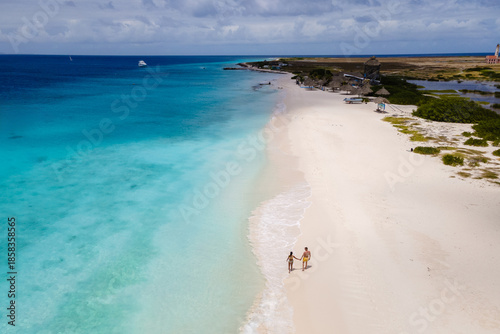 Принти на полотні Couples stroll hand in hand along the pristine white sands of Klein Curacao
