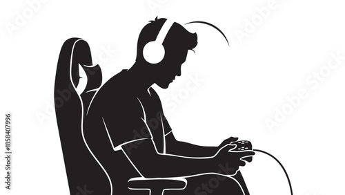 Silhouette of a young man wearing headphones playing video game on controller