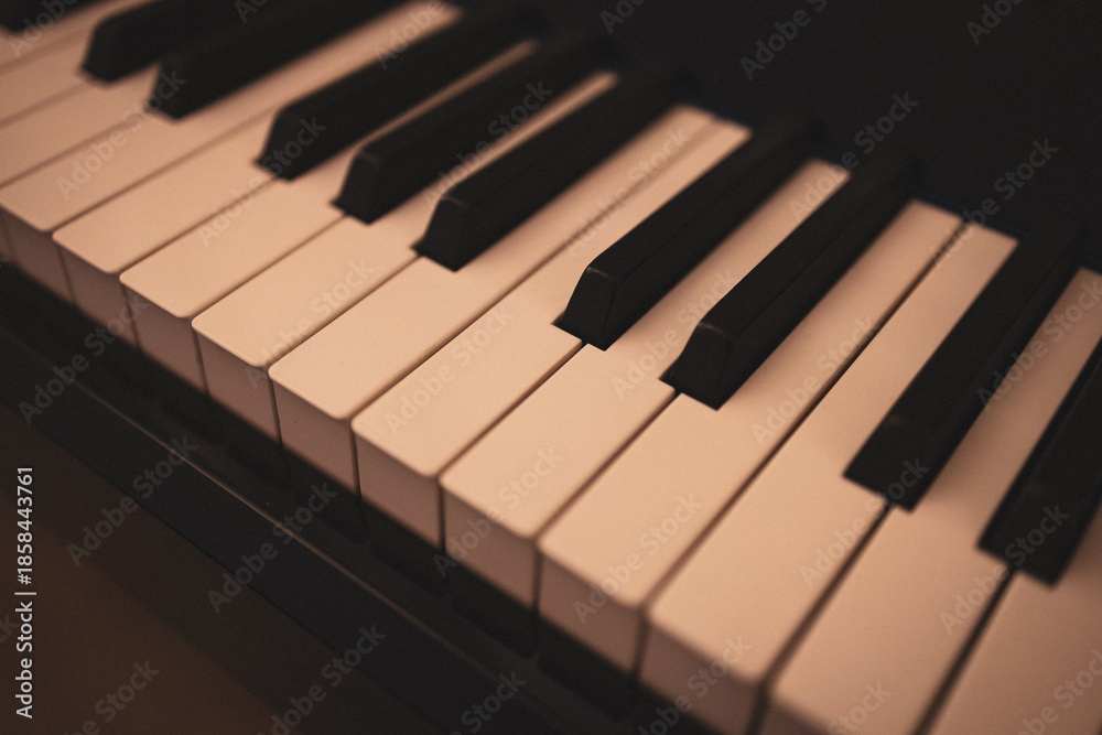 Fototapeta premium Upright piano details in cozy indoor night lighting