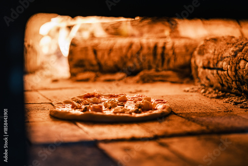 Tableau sur toile Traditional pizza cooking in wood fired oven