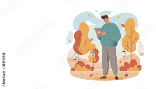 Man using tablet for remote work in a cozy autumn park Digital lifestyle concept