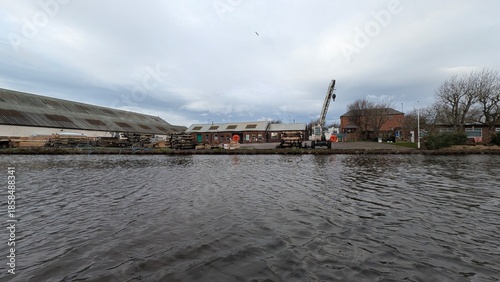 industrial waterfront with warehouse and crane structure