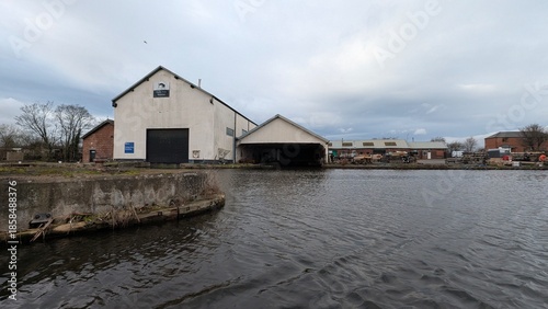 serene view of warehouse by the water
