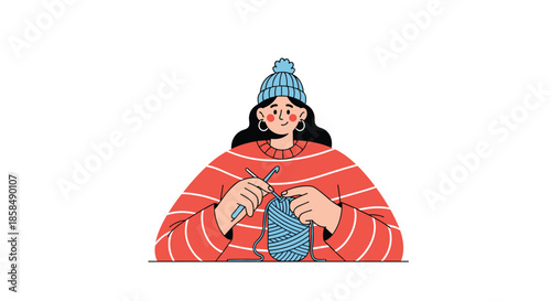 Young woman wearing a beanie and a red striped sweater enjoying her hobby of knitting with blue yarn.