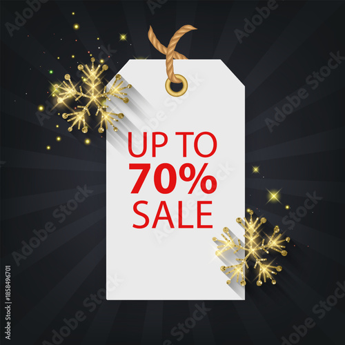 Christmas and Winter sale vector banner template. A white price tag hanging on a rope with "UP TO SALE" The design features elegant golden glittering snowflakes and shimmering light particles on a dar