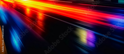 Neon Light Trails On Wet Road Create Speedy Motion Blur Background And Colorful Reflections