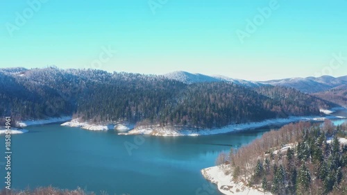 Beautiful winter panorama, Gorski kotar, Lokvarsko lake and Risnjak mountain in Croatia, frost on trees 