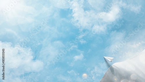 Empty sheet of paper beneath a clear blue sky, serving as a neutral surface for creative or professional layouts