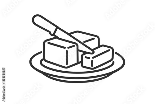 Butter on a plate with a knife