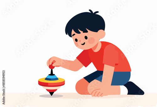 A young boy plays with a colorful spinning top on the floor