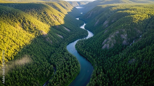 Aerial view of a winding river flowing through a lush green valley landscape