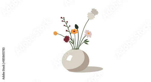 Minimalist bouquet of delicate wildflowers in various colors arranged in a simple round ceramic vase on a surface.