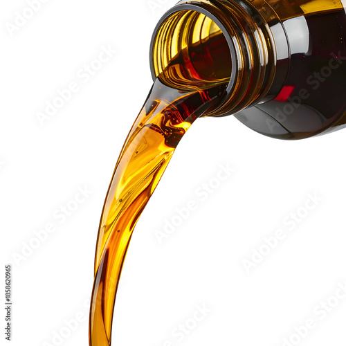 Amber liquid pouring from a bottle, cascading down against a black background