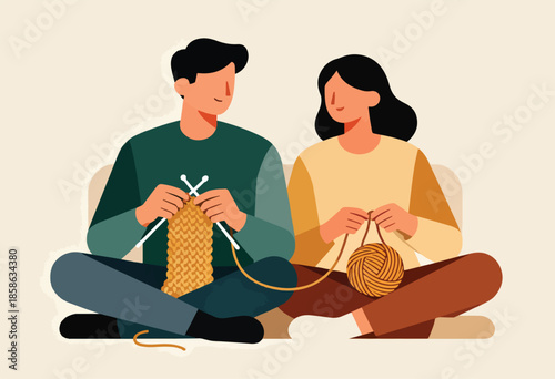 Couple sitting cross-legged, happily knitting together