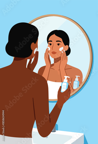 Person applying moisturizer to face in front of mirror with skincare bottles