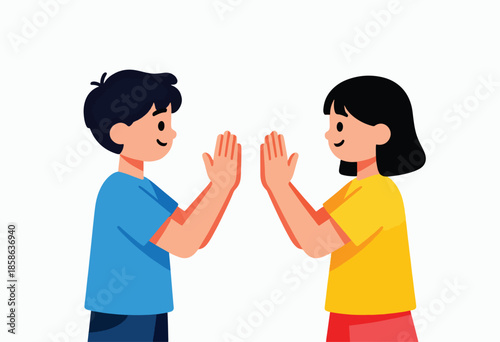 Two children with smiling faces, hands raised in a high five gesture