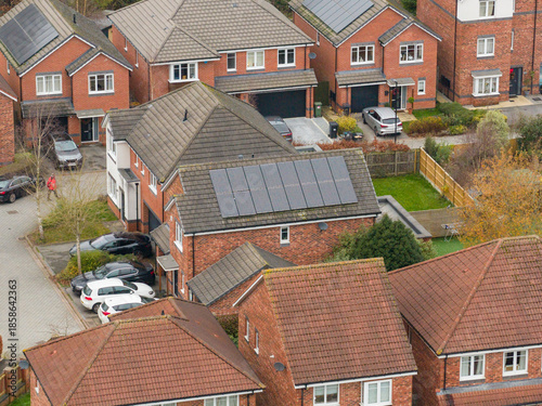 Aerial drone photo of the village of Huntington in the City of York in North Yorkshire England showing a new housing estate with energy saving solar panels on the side of the property in the winter