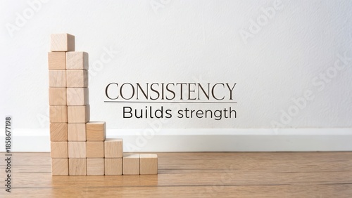 Wooden cube tower ascending a step design with consistency message