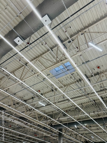 Warehouse Illuminated With Energyefficient Lights, Industrial Facilities Equipped With Large Windows And Energysaving Lighting To Maximize Natural And Artificial Illumination