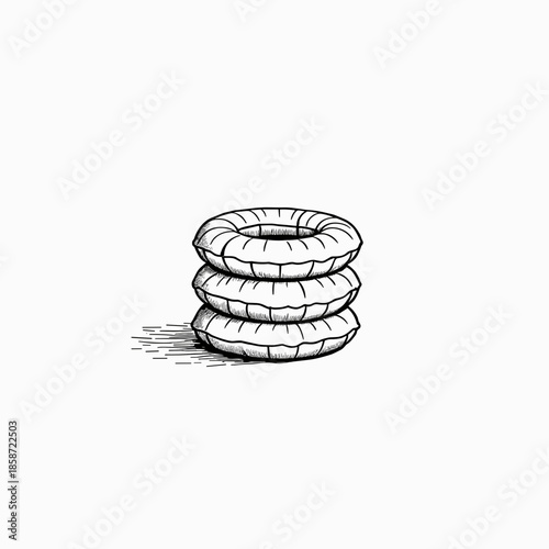 Stack of inflatable snow tubes on white background for winter fun  