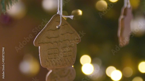 Christmas tree gingerbread cookie decoration on branch