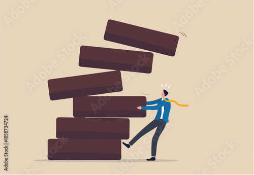 Investment risk, failure or mistake for greedy decision, business strategy to be careful and balance on instability and uncertainty concept, businessman pulling wooden block from collapsing stack.
